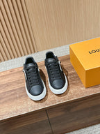 Louis Vuitton lace-up sneakers, black with white sole, side view (pair)