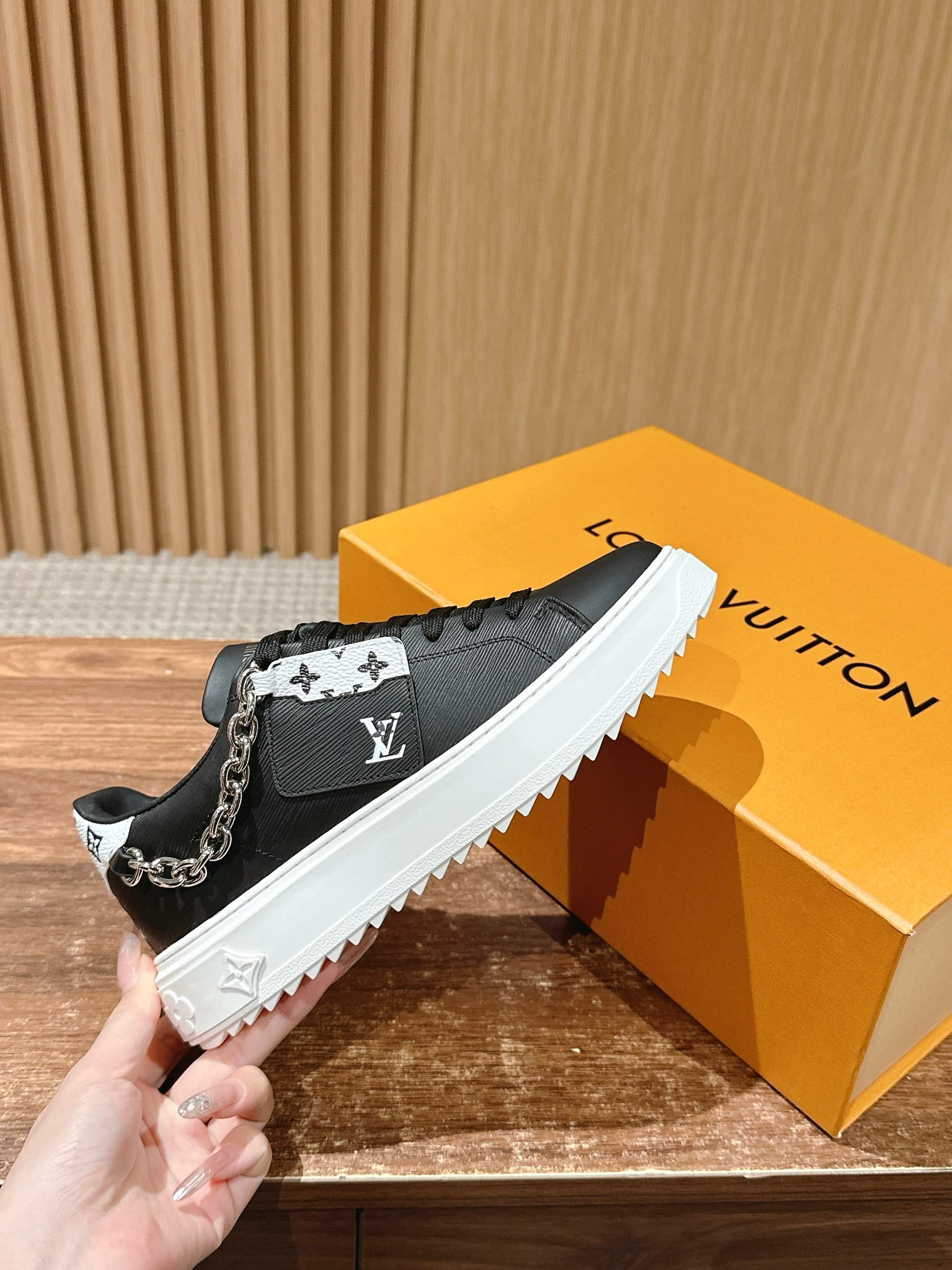 Louis Vuitton lace-up sneakers, black with monogram cuff, white sole and chain detail