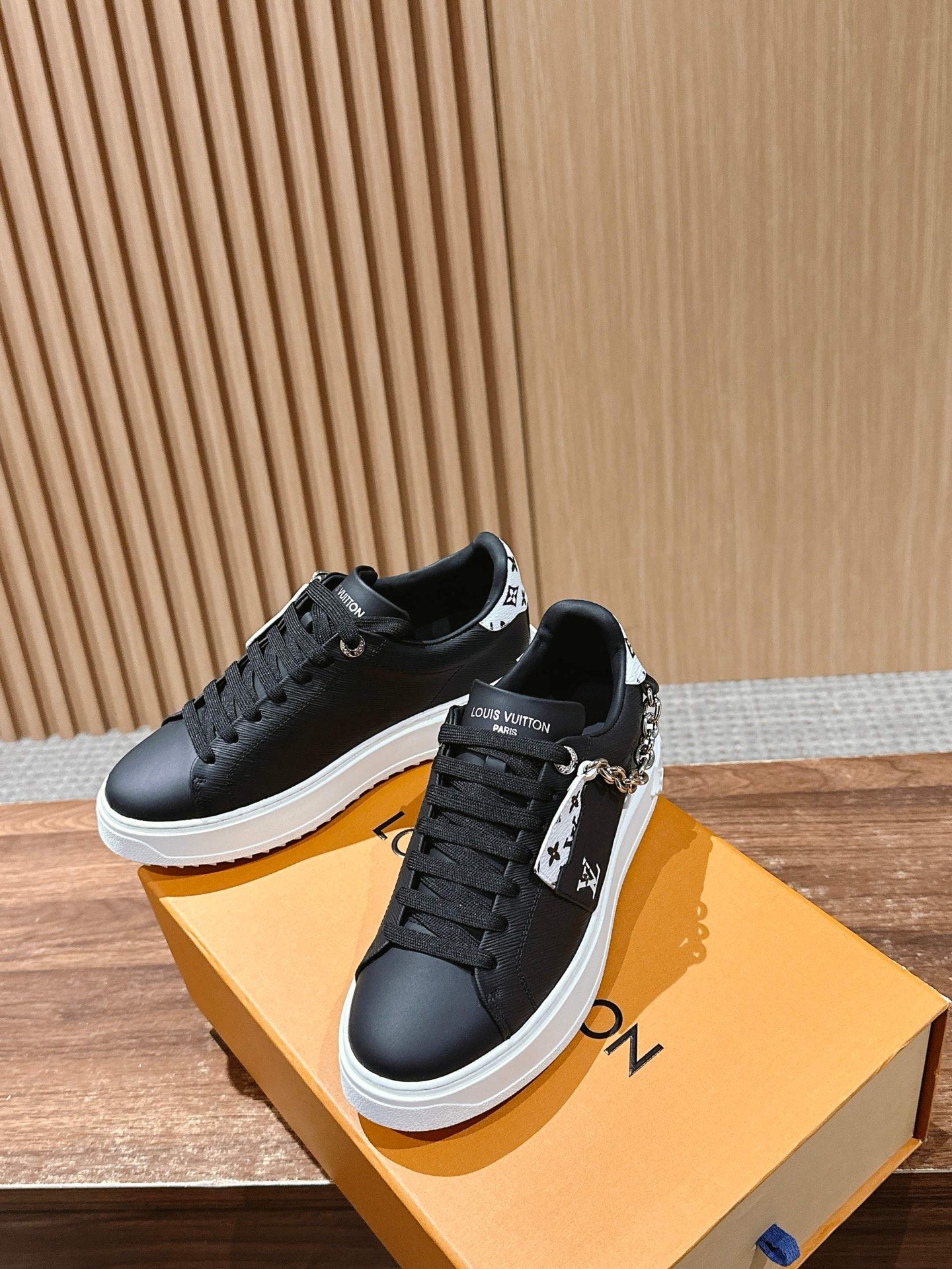 Louis Vuitton lace-up sneakers, black, white sole, chain and logo strap detail