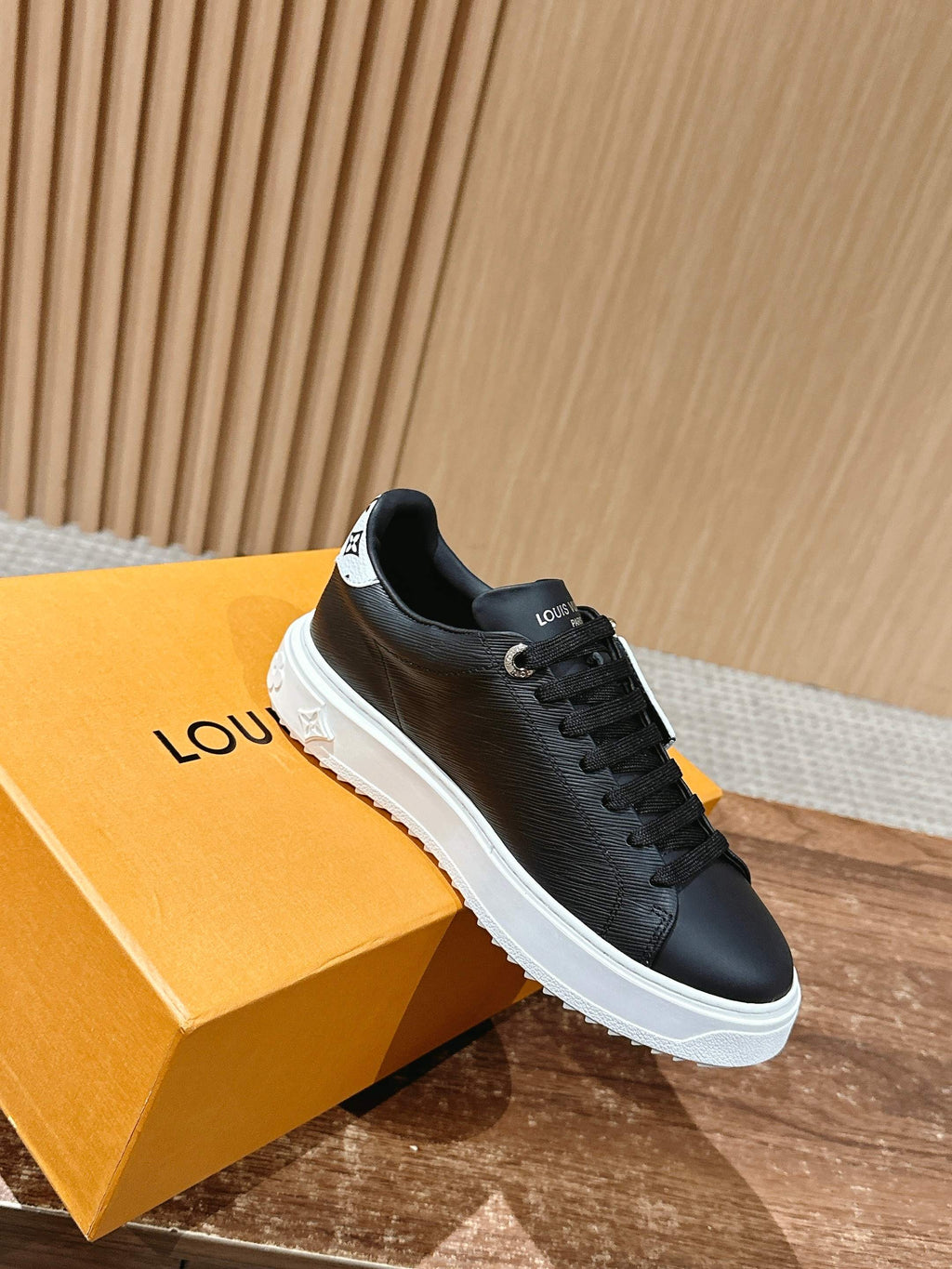 Louis Vuitton lace-up sneakers, black, white rubber sole, single shoe on box