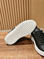 Louis Vuitton sneakers outsole view, black upper with white sole tread
