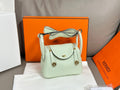 Hermes mint leather handbag with front flap and top handle