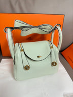 Hermes mint leather handbag with crossbody strap and front flap