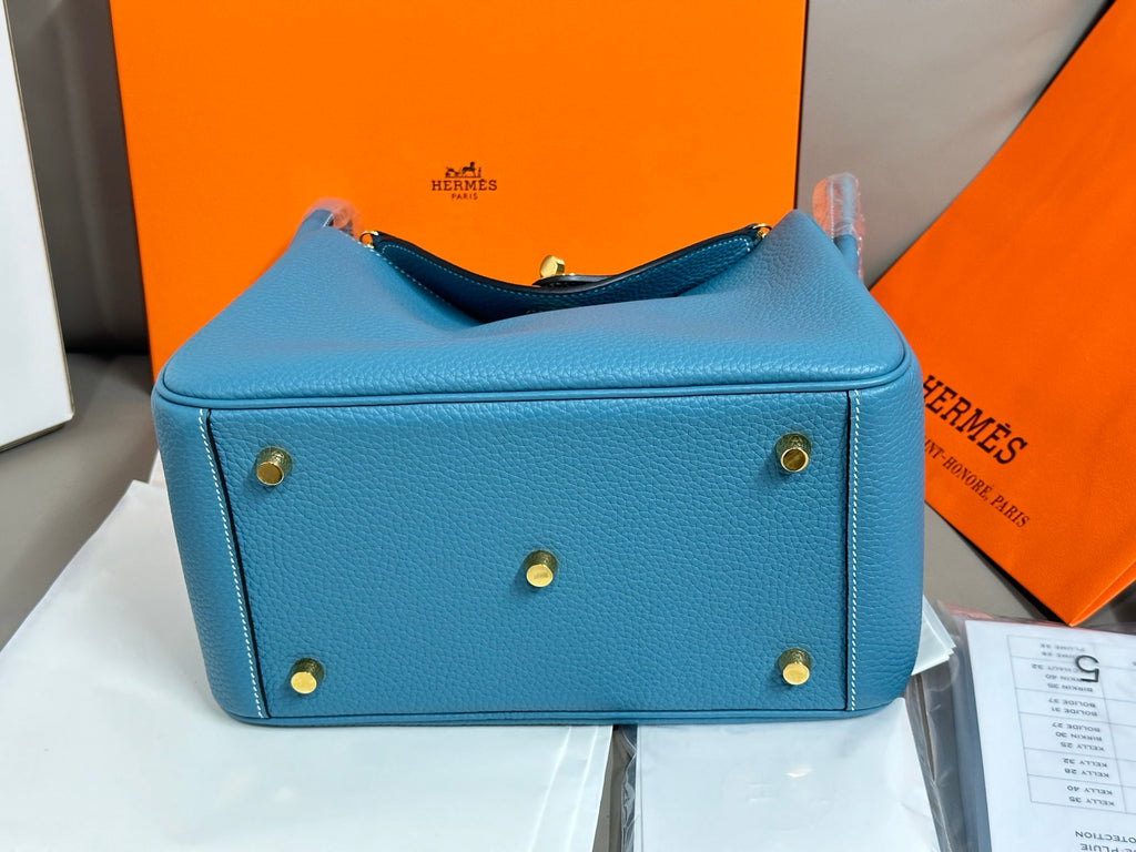 Hermes blue leather mini handbag with top zip and gold-tone feet
