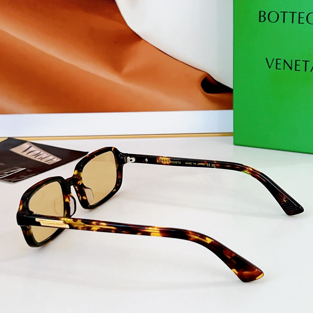 Bvlgari sunglasses: tortoiseshell frames with amber lenses and gold-tone hinges.