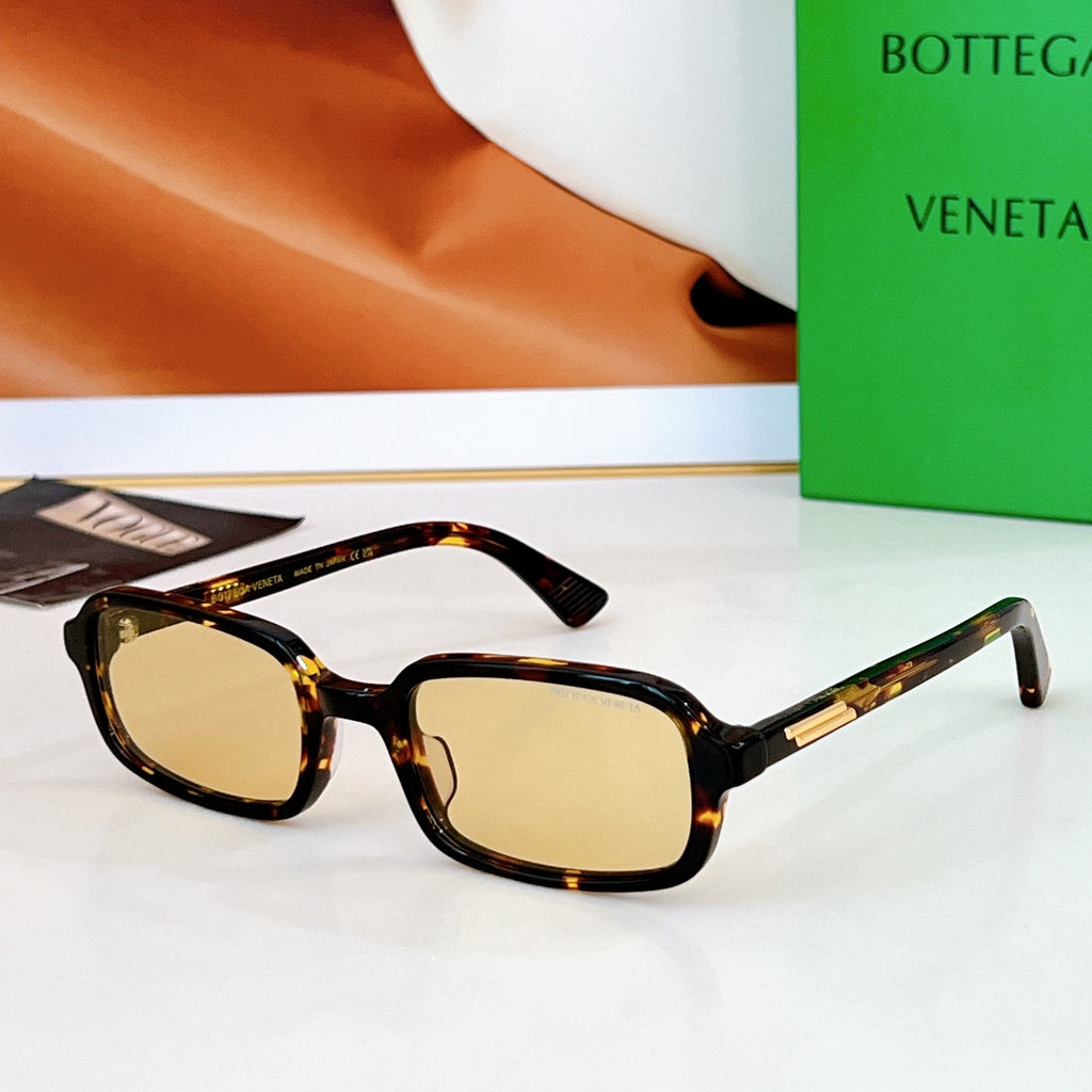 Bvlgari sunglasses: dark tortoiseshell frames with light amber lenses and gold detail.