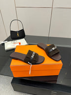 Ladies’ suede slide sandals with dark straps and silver buckle, flat open-toe