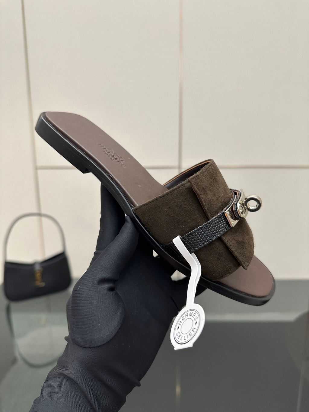 Ladies’ suede slide sandal with silver buckle strap and low flat heel