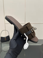 Ladies’ suede slide sandal with silver buckle strap and low flat heel