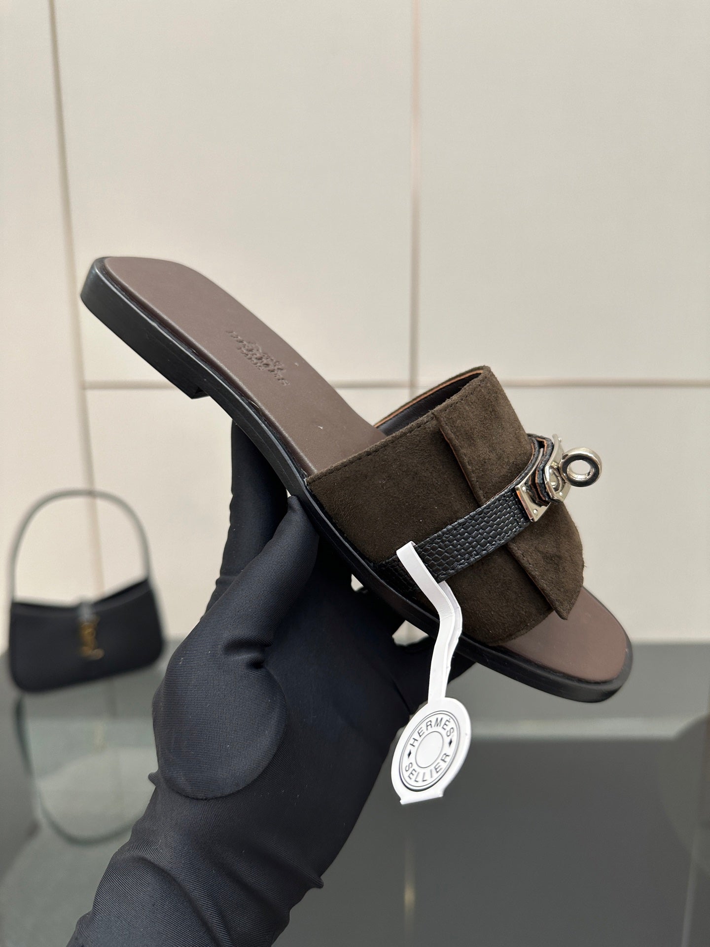 Ladies’ suede slide sandal with silver buckle strap and low flat heel