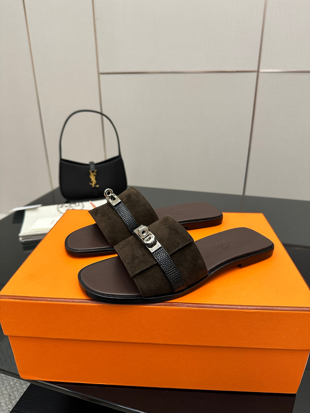 Ladies’ suede slide sandals with silver buckle and dark strap over the foot