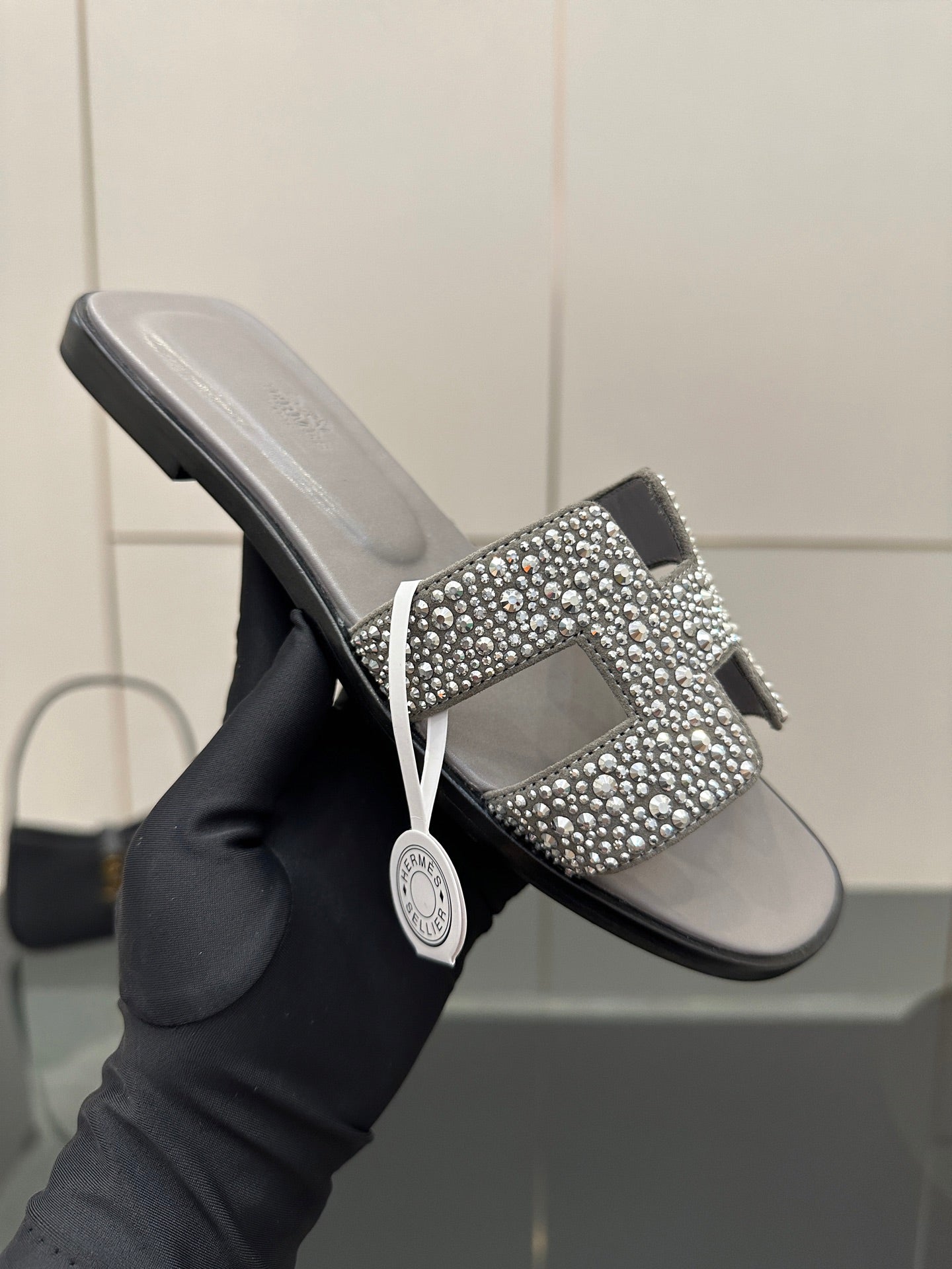 Women's rhinestone slide sandal, gray upper with sparkling H-style ornament on strap