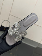 Women's rhinestone slide sandals, gray slip-ons with gem-studded buckle across strap