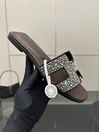 Hermes ladies slide sandal, black rubber sole with silver rhinestone H buckle top