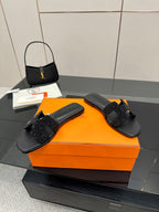Black slide sandals with glitter cross strap, pair view