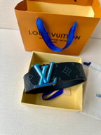 Louis Vuitton monogram belt with oversized blue LV buckle on dark strap