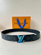 Louis Vuitton monogram belt with dark strap and blue LV buckle, flat profile