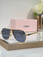 Celine glasses, gold-tone metal sunglasses with blue-tinted lenses