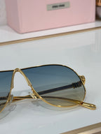 Celine glasses, gold-tone metal frame with blue-tinted lenses