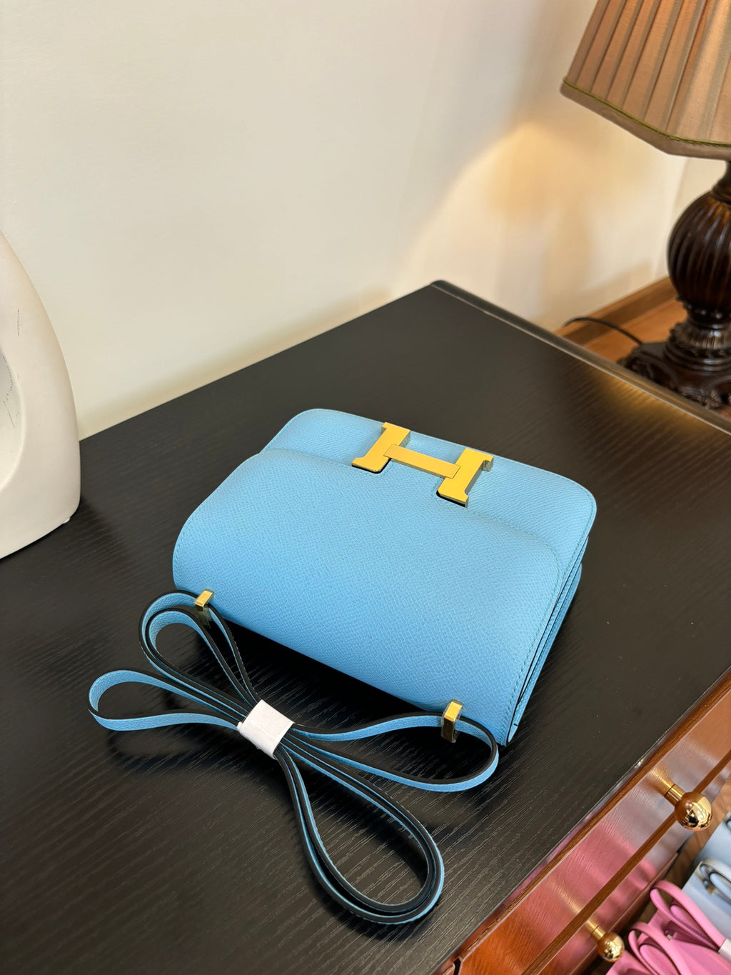 Hermes H bag light blue with gold H clasp, flat top, and attached strap cords