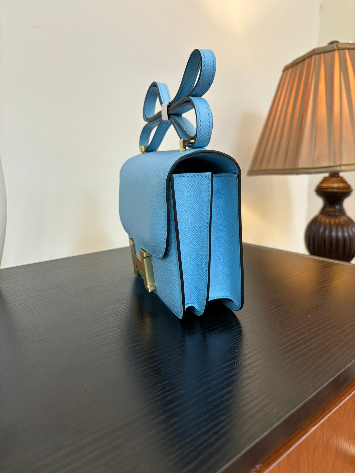 Hermes H bag in light blue with gold hardware and curved strap handles