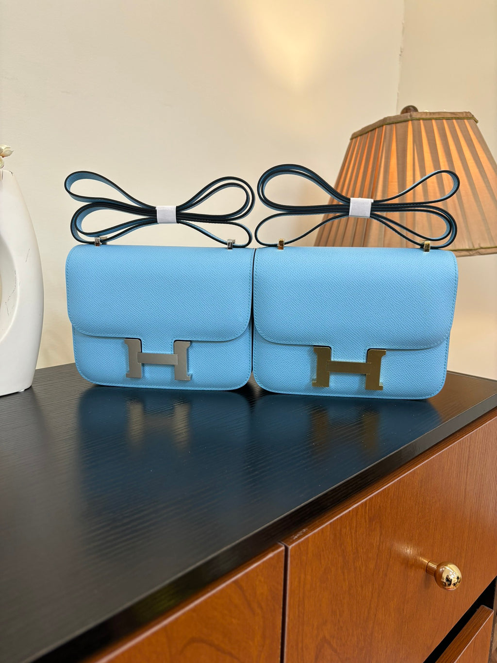 Hermes H bag in light blue with gold H front clasp and top handle straps