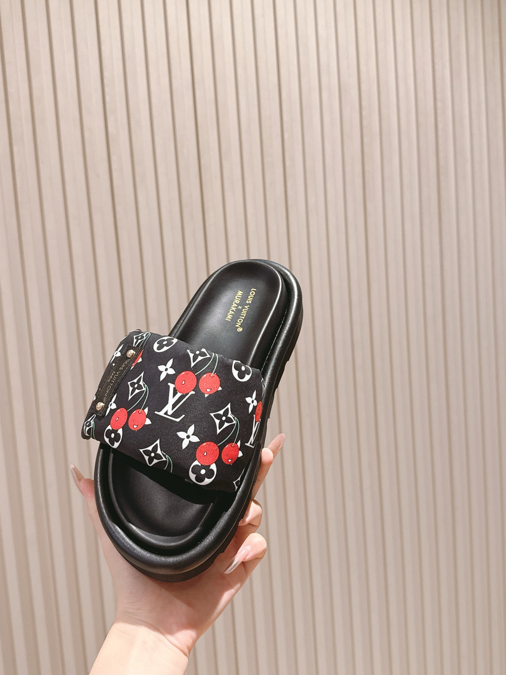 Louis Vuitton slide sandal, black with multicolor monogram print foot strap.