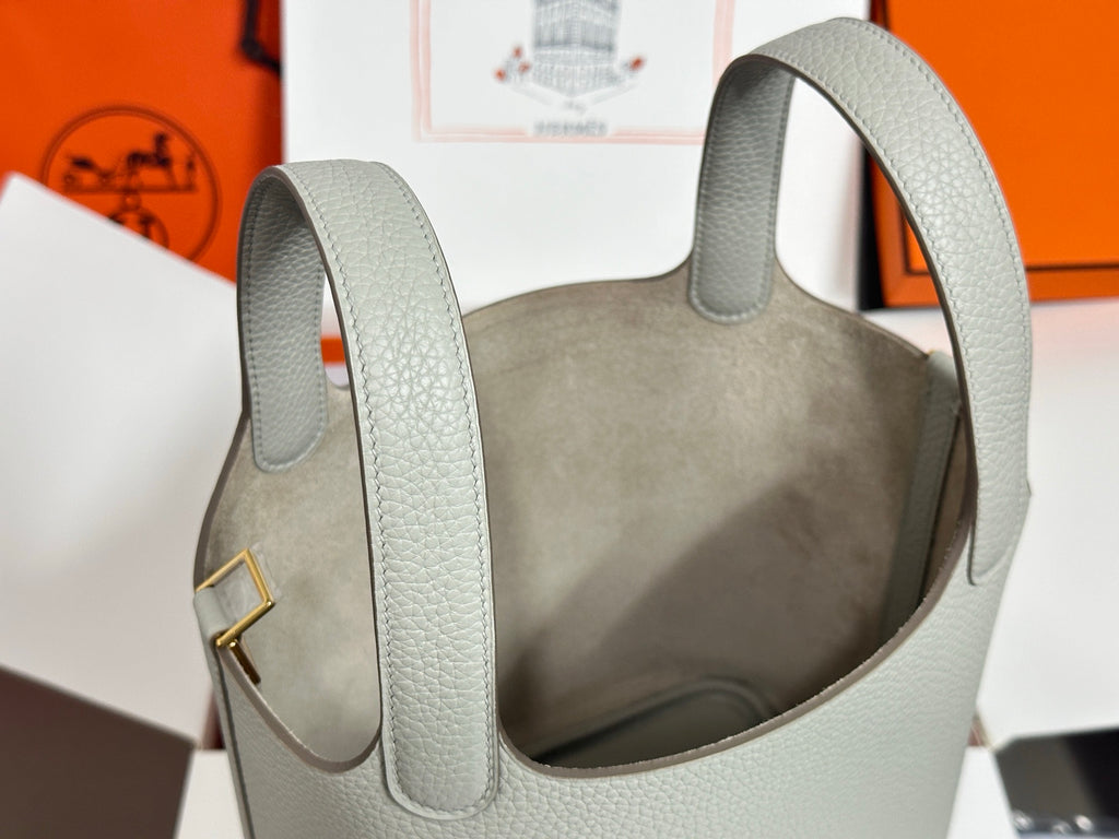 Hermes pale gray textured leather tote bag close-up of handles and open top