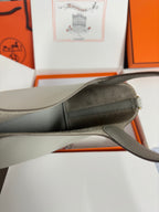 Hermes pale gray leather tote bag close-up of side panel and shoulder strap