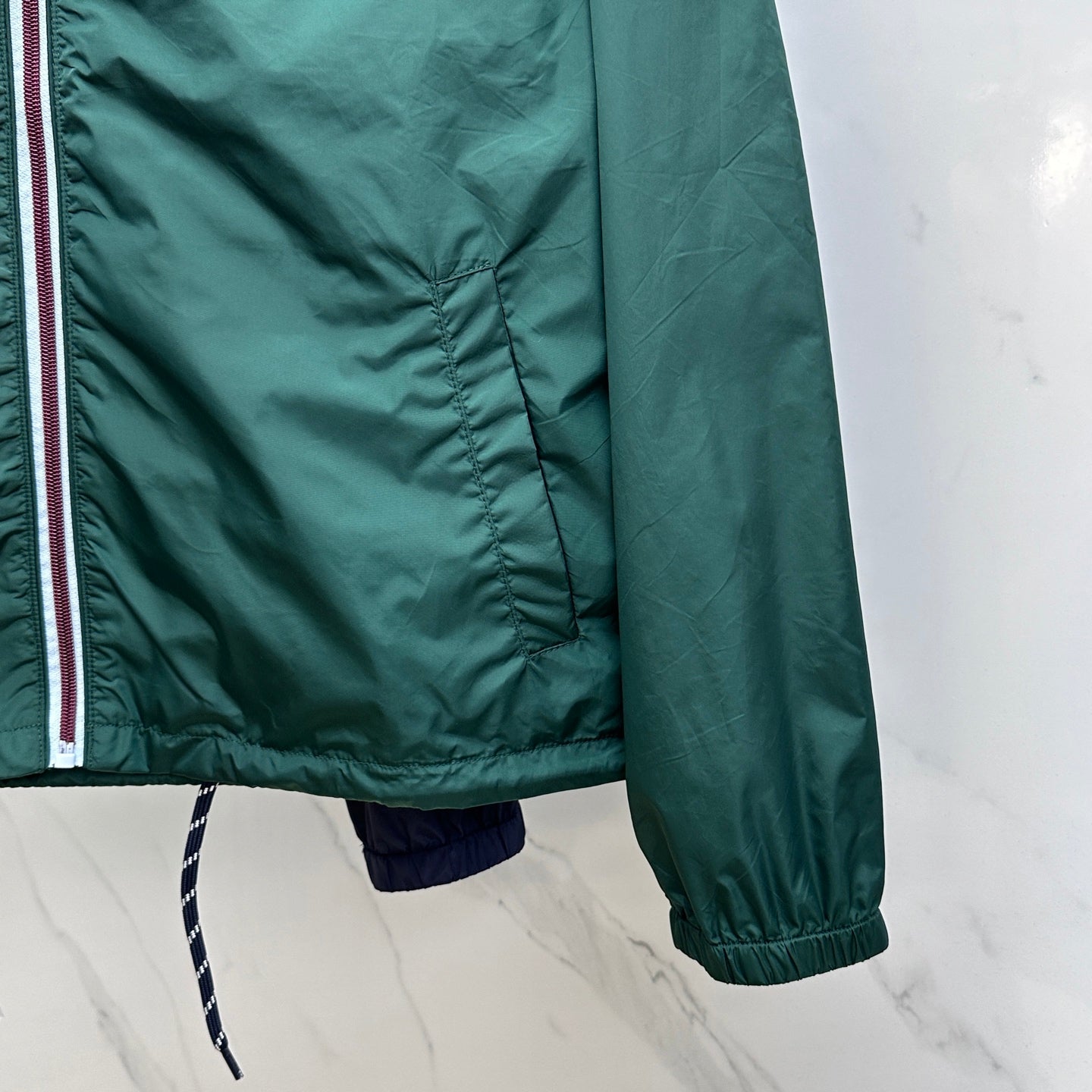 Prada Re-Nylon hooded jacket, dark green with elastic cuff and paneled side hem
