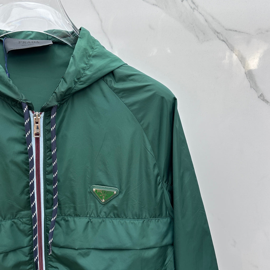 Prada Re-Nylon hooded jacket, dark green side view with triangular logo patch