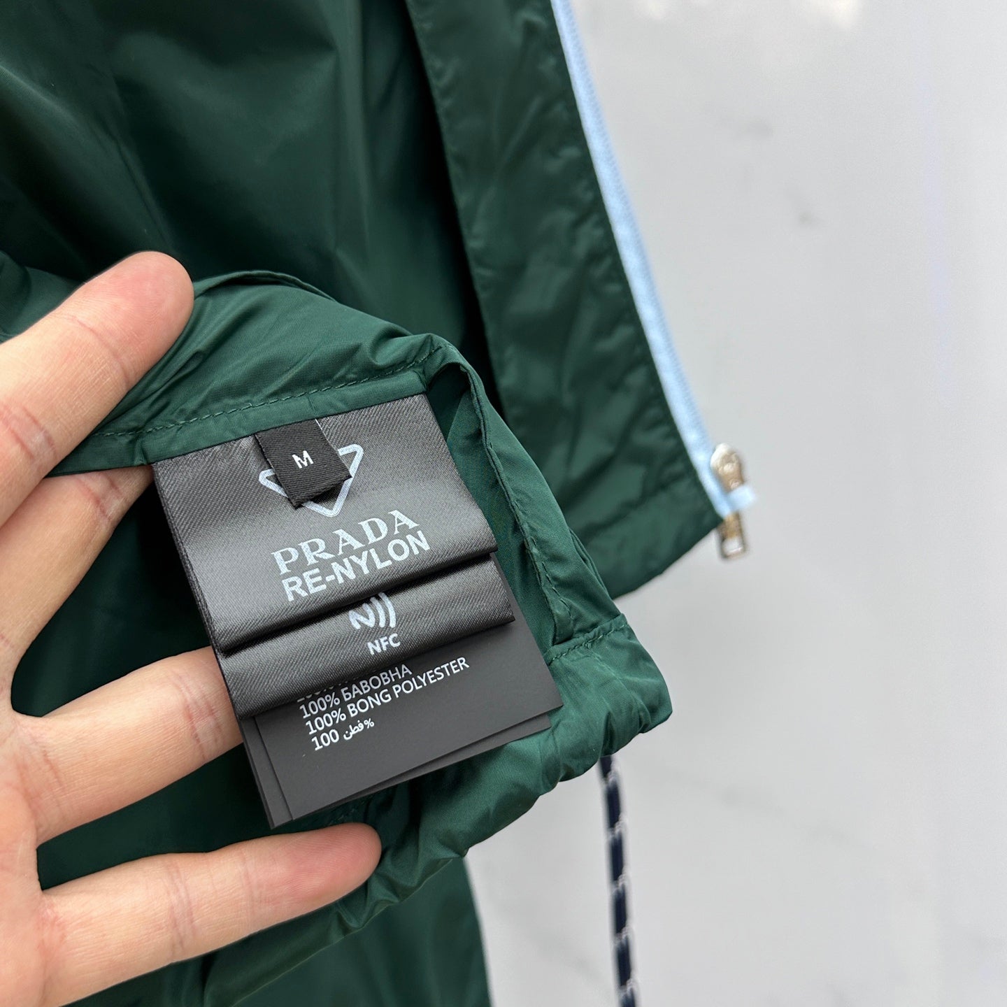 Prada Re-Nylon jacket size M fabric tag with RE-NYLON and NFC text