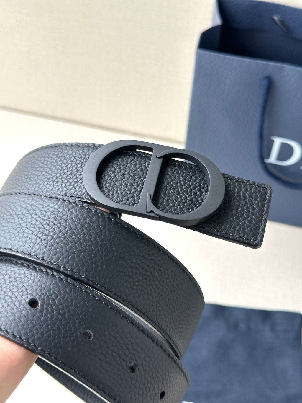 Black textured leather Dior belt with CD buckle and stitched edge