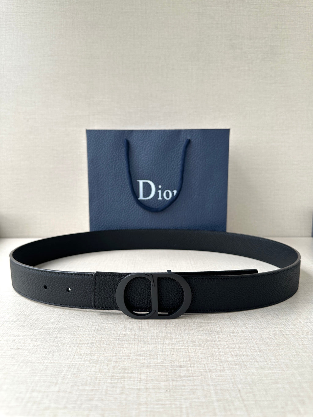 Dior leather belt in black with engraved CD buckle and prong holes