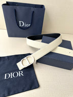 Beige leather Dior belt with oversized logo buckle and adjustable strap