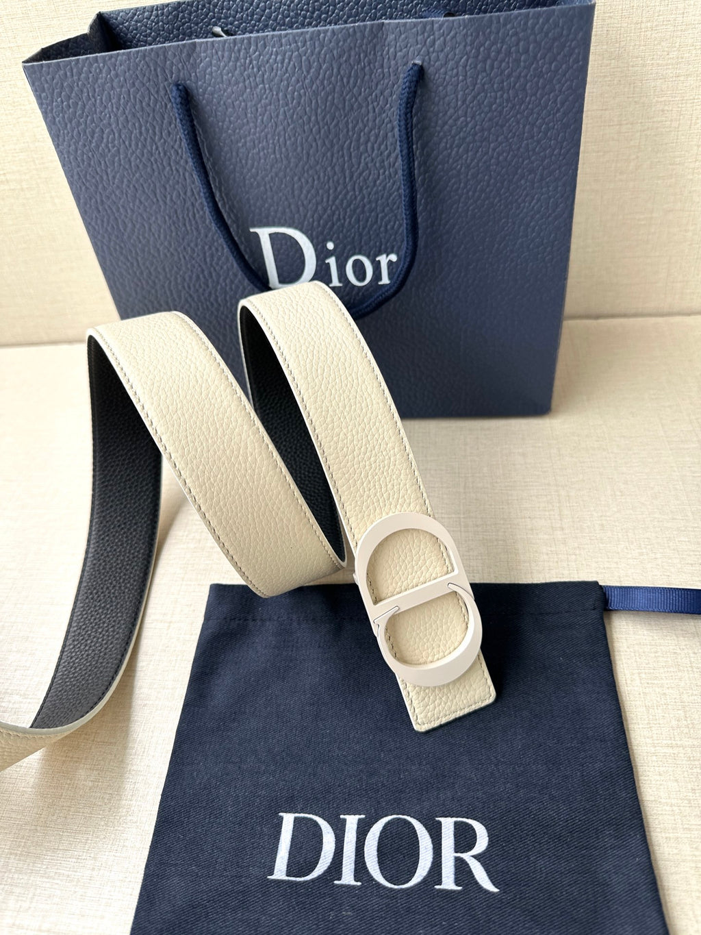 Beige leather belt with double-ring buckle detail and embossed Dior logo