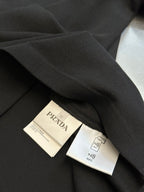 Prada polo shirt care tags and NFC tag on dark inner fabric