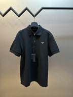 Prada short-sleeve polo shirt with dark collar and front button placket, logo patch