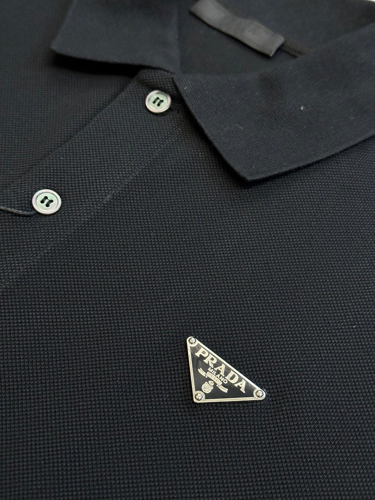 Prada polo shirt chest logo patch on dark textured fabric with buttoned placket