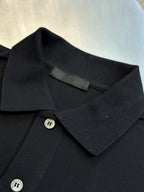 Prada dark polo shirt neckline with two-tone buttons and collar