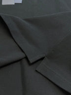 Prada dark polo shirt fabric and button placket detail