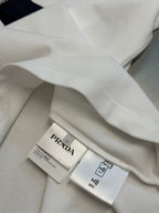Polo shirt interior view with PRADA label and care tags