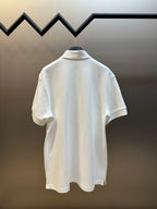 White Prada polo shirt back view with short sleeves and ribbed stand collar.