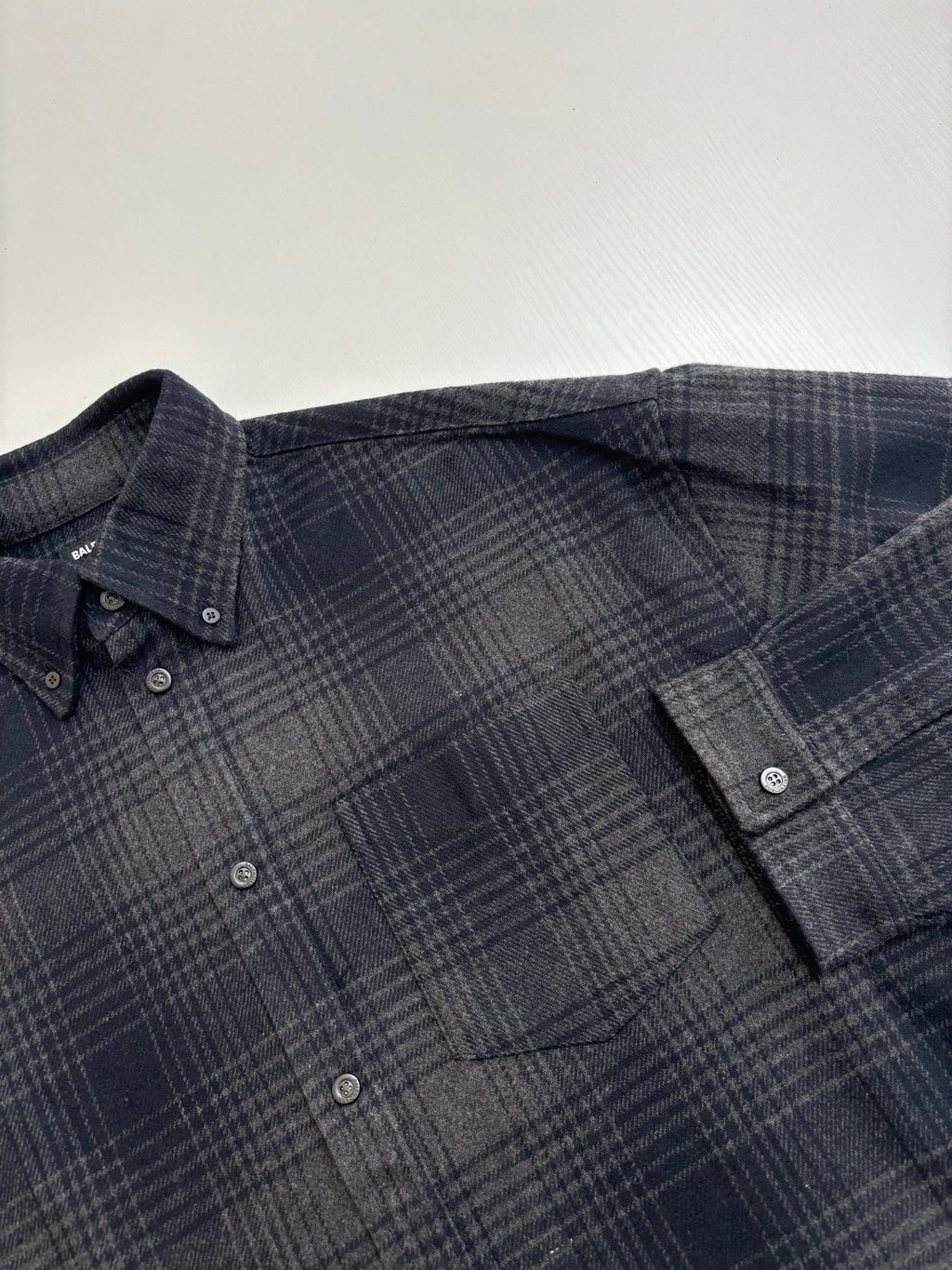 Balenciaga plaid button-up shirt, dark navy check pattern, button placket
