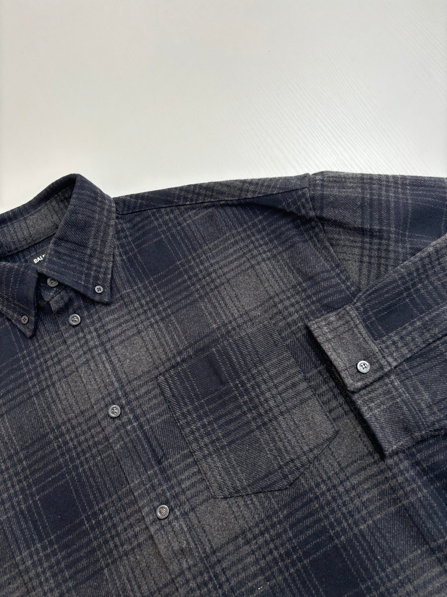 Balenciaga plaid button-up shirt, dark navy check pattern, button placket