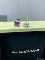 Purple clover stud earrings with silver-tone posts in Van Cleef & Arpels box