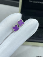 Purple clover stud earring detail with silver-tone setting
