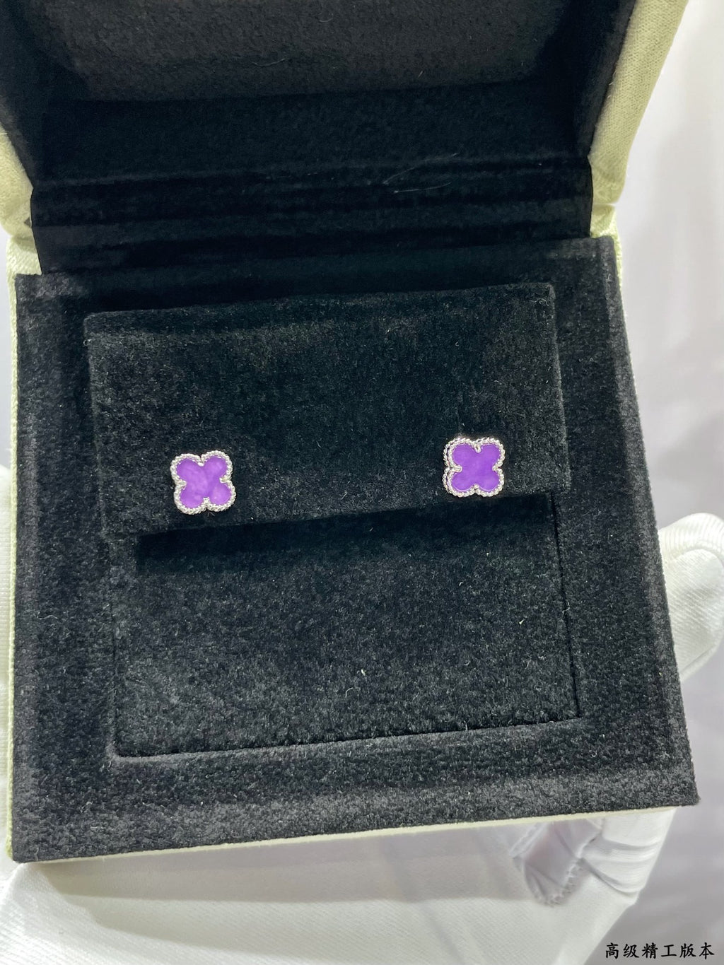 Purple clover stud earrings in dark velvet Van Cleef & Arpels box