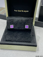 Purple clover stud earrings in Van Cleef & Arpels display box