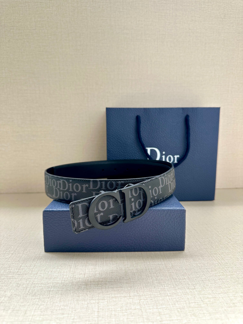 Navy Dior monogram belt with square silver buckle and embossed logo print